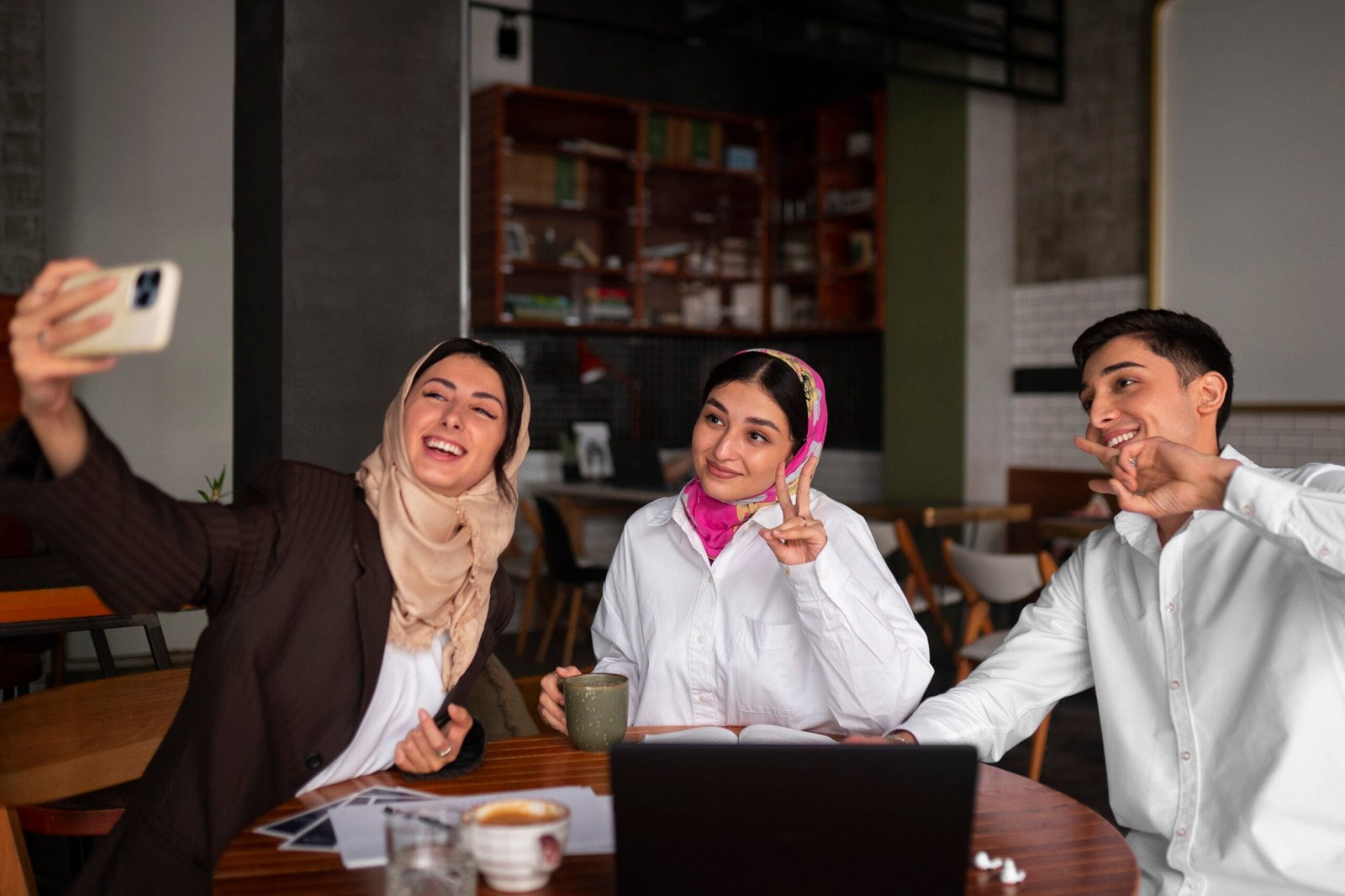 medium-shot-arab-friends-taking-selfie